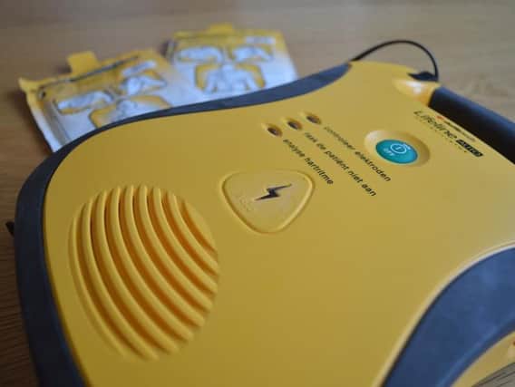 A defibrillator is a device which gives a high energy electric shock to the heart through the chest wall to someone who is in cardiac arrest. This high energy shock is called defibrillation and is an essential life-saving step in the chain of survival. Stock picture.
