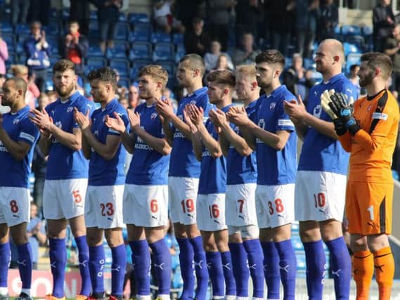 Chesterfield players pay tribute to Kevin Randall.