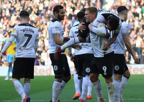 After scoring, Derby County midfielder Duane HOLMES gets carried by his team mate Derby County forward Martyn WAGHORN during the match between Derby County FC and Rotherham United FC at Pride Park Stadium Derby - 30-03-19  - image Jez Tighe