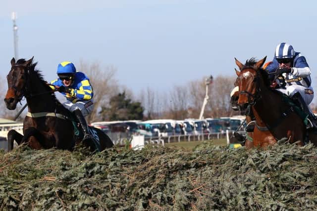 Jumping the last fence in the Grand National, before the drama of the 'Elbow'. (PHOTO BY: Alex Livesey/Getty Images)