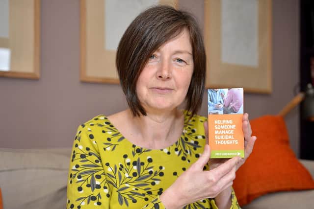 Tricia Black with the suicide prevention leaflet she has produced. Picture by Rachel Atkins.