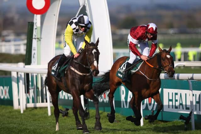 Tiger Roll (right) just holds off Pleasant Company to win last year's Grand National. Both are back for more on Saturday. (PHOTO BY: Alex Livesey/Getty Images).