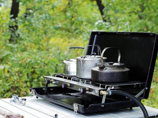 New camping stoves with no fuel attached. Allowed in hold: Yes. Allowed in luggage: Yes.  You need to bear in mind that if the stove is used during your travels, you may not carry it on any subsequent flight.