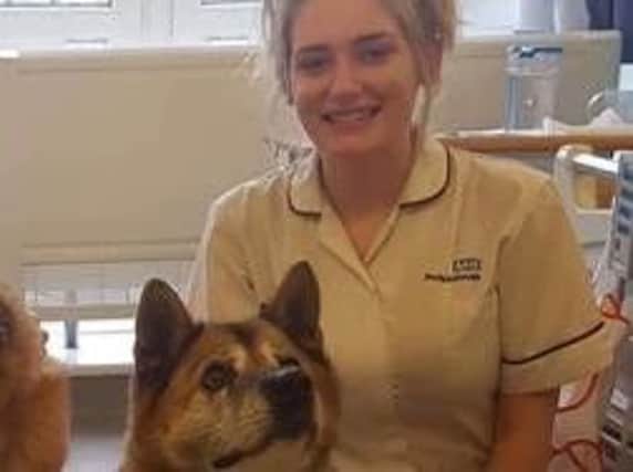 Elle Reynolds with Sumi, one of Chesterfield Royal Hospital's therapy dogs.