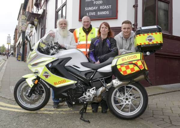 The New Inn at Ilkeston raising money for Derbyshire Blood Bikes in memory of customer Jamie Henshaw
publican Ken Harrison has grown his hair and beard for a year, pictured with Mark Vallis (blood Bike co-ordinator), Jamie's wife, Lisa and son Julian