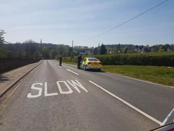 Police have closed a section of the main road through New Whittington after a crash.