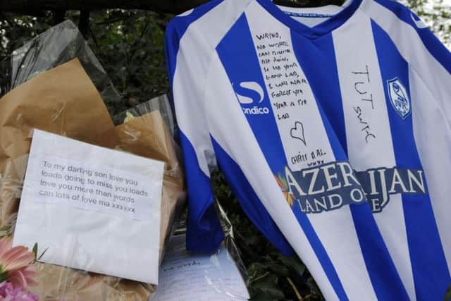 Dozens of tributes have been left at the scene of the crash in New Whittington.
