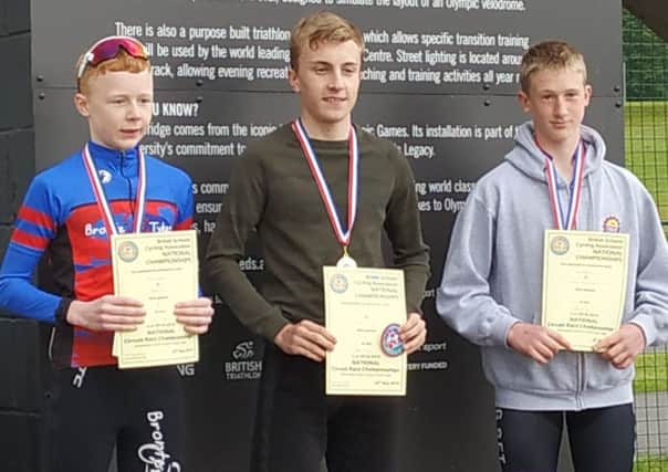 Ryan Williams (centre) on the podium after his success.