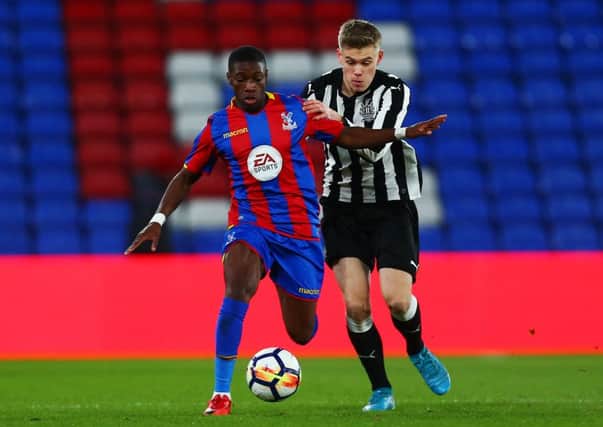 LONDON, ENGLAND - JANUARY 19:  Joseph Hungbo of Crystal Palace avoids a challenge from Matty Longstaff of Newcastle during the FA Youth Cup Fourth Round match between Crystal Palace and Newcastle United at Selhurst Park on January 19, 2018 in London, England.  (Photo by Jordan Mansfield/Getty Images)