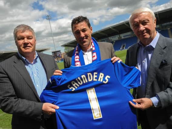 Chris Turner, then CEO, and owner Dave Allen unveiled Dean Saunders as boss on this day four years ago