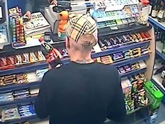 Do you recognise this man with distinctive bat tattoo?