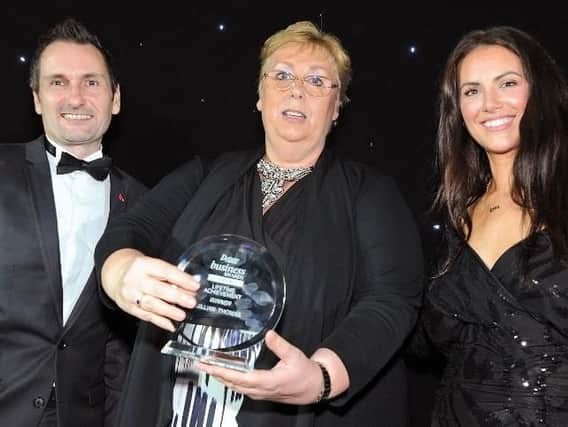 Jillian Thomas with her Lifetime Achievement Award, presented by Derbyshire Times editor, Phil Bramley, and former Apprentice star Jessica Cunningham.