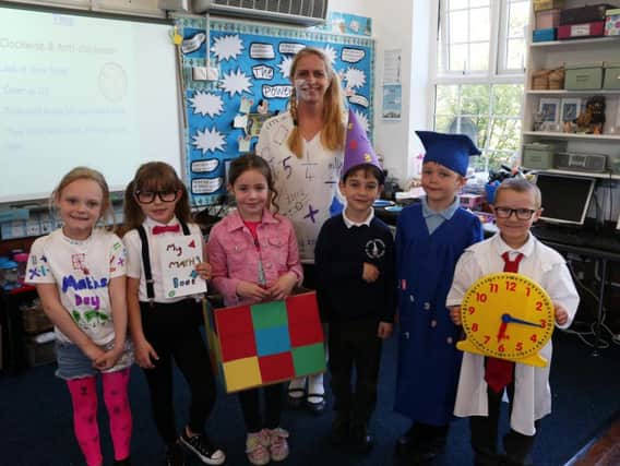 Youngsters and staff from Spire Infant School enjoying the maths day. Pictures by Eric Gregory.