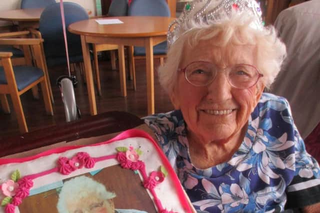 Edie Littlewood, 103, with her birthday cake.