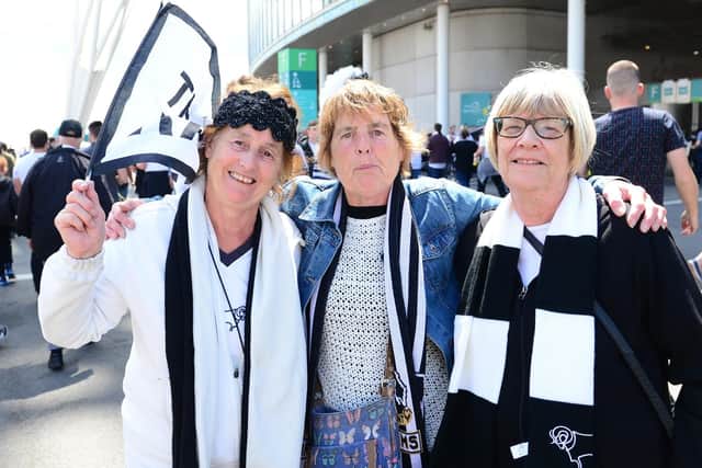 Derby County fans light up Wembley Way.