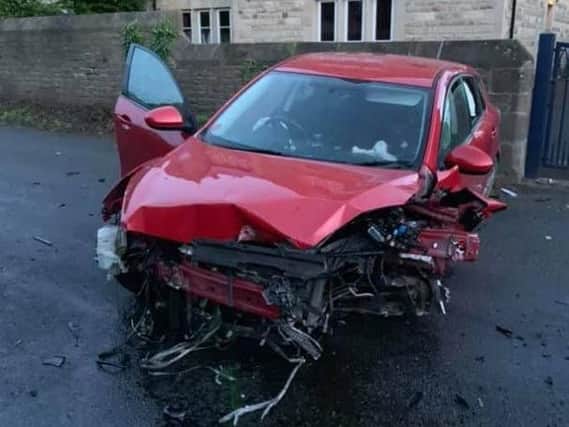 A picture of the damaged Mazda 3.