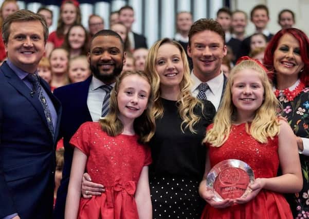 Great Longstone choir Perfect Pitch is celebrating after winning the Songs of Praise Young Choir of the Year 2019. Musical director Emma Hopkins, centre, with performers and judges.