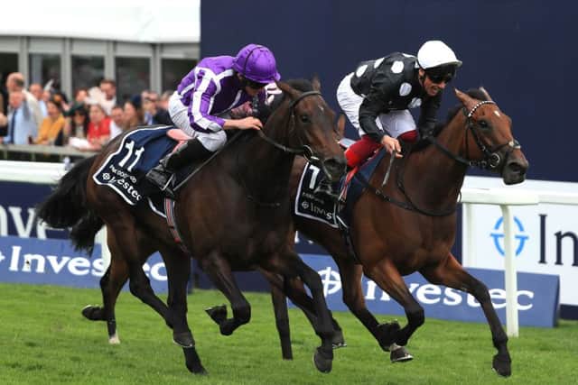 Anapurna (farside), ridden by Frankie Dettori, shades Pink Dogwood to win the Investec Oaks at Epsom. (PHOTO BY: Andrew Redington/Getty Images).