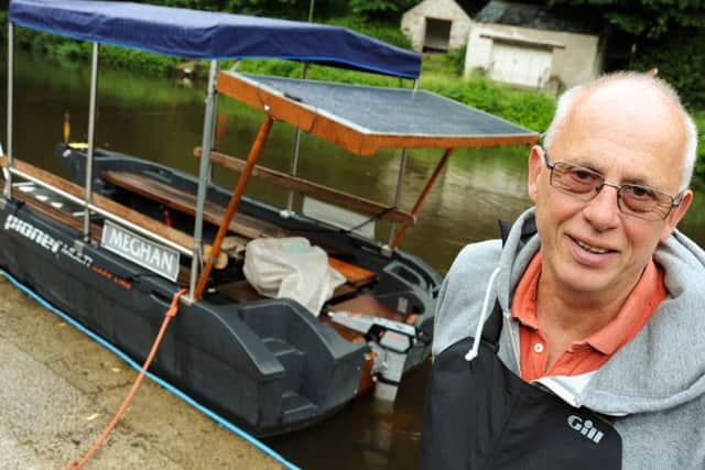Paul Henshall with his solar powered boat at Matlock Bath.