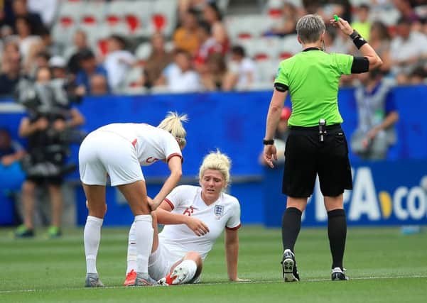 NICE, FRANCE - JUNE 09: Millie Bright of England reacts with an injury during the 2019 FIFA Women's World Cup France group D match between England and Scotland at Stade de Nice on June 09, 2019 in Nice, France. (Photo by Marc Atkins/Getty Images)