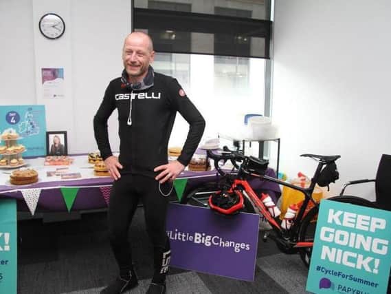 Nick Brailsford stopped off at the office for some motivation as he cycles the length of the UK for charity.