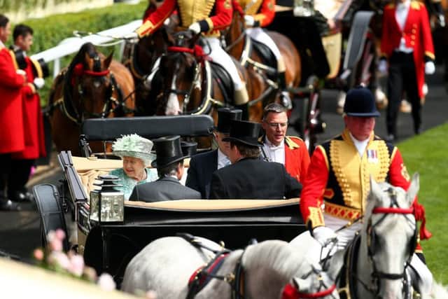The Queen takes part in the royal procession before racing at Ascot (PHOTO BY: Charlie Crowhurst/Getty Images)