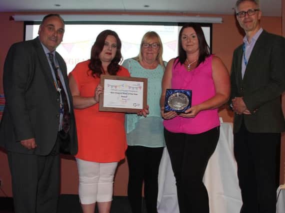 Representatives from the Chesterfield-based Hartington Unit reception team, winners of the Non-Clinical Team of the Year Award, with Trust chief executive Ifti Majid and deputy director of nursing Darryl Thompson.