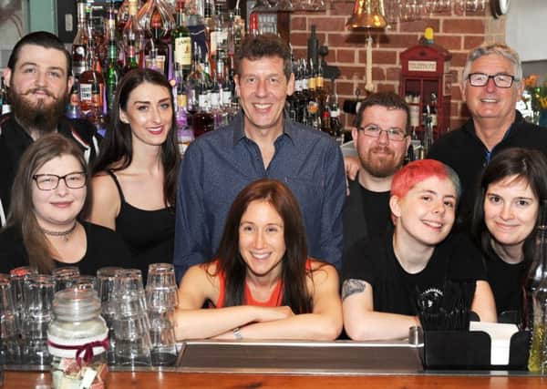 Staff at Chandlers celebrates the bar's 20th birthday.