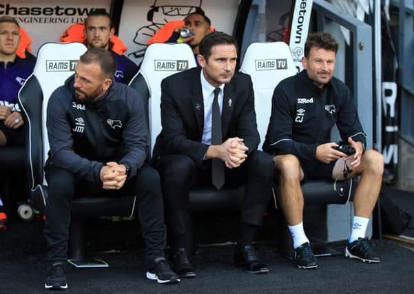 Frank Lampard manager of Derby County (C) flanked by Assistant manager Jody Morris (L) and First Team Coach Chris Jones (R). Photo by Marc Atkins/Getty Images.