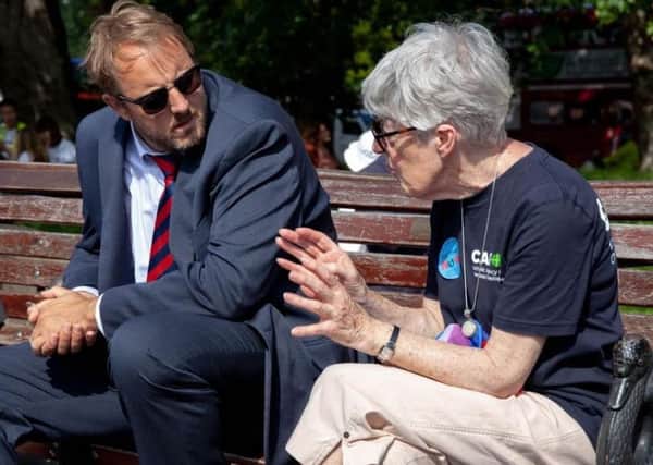 Anne Peacey speaks to Chesterfield MP Toby Perkins outside Parliament. Pic: Jessie Keable-Elliot