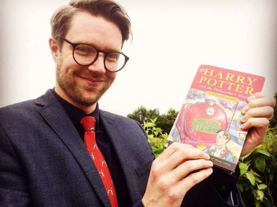 Jim Spencer with the Harry Potter first edition.