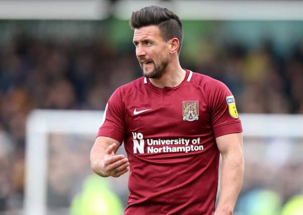 NORTHAMPTON, ENGLAND - APRIL 13: David Buchanan of Northampton Town in action during the Sky Bet League Two match between Northampton Town and Mansfield Town at PTS Academy Stadium on April 13, 2019 in Northampton, United Kingdom. (Photo by Pete Norton/Getty Images)