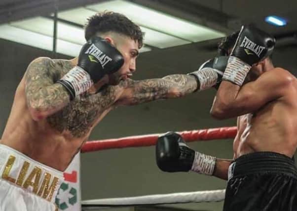 Chesterfield boxer Liam Dring on his way to victory in his first fight as a professional.