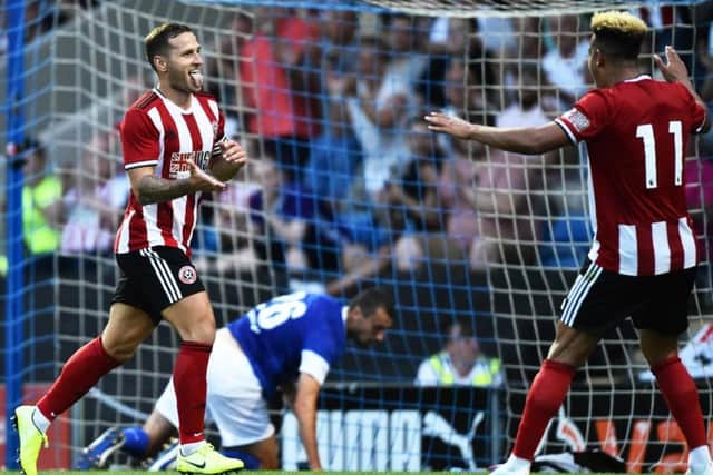 Billy Sharp celebrates scoring at the Proact, as Hollis gets up off the floor in the background (Pic: Getty)
