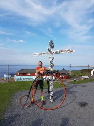 Matlock teaching assistant Richard Thoday has smashed a 133-year-old world record after riding from Land's End to John O'Groats on a penny farthing.