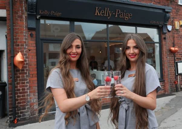 Kelly and Paige Stevenson celebrate opening of their new salon.
