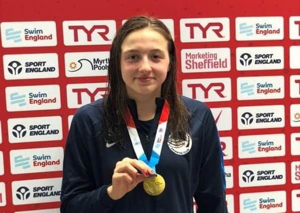 Proud Sophie Baker, of Chesterfield Swimming Club, clutching her gold medal.