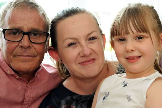 Grace Thompson 4, at home with dad David and mum Izabela.