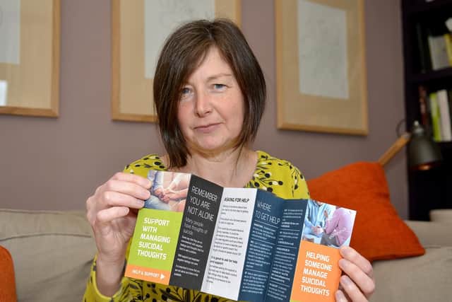 Tricia Black with with the suicide prevention leaflet she produced earlier this year.