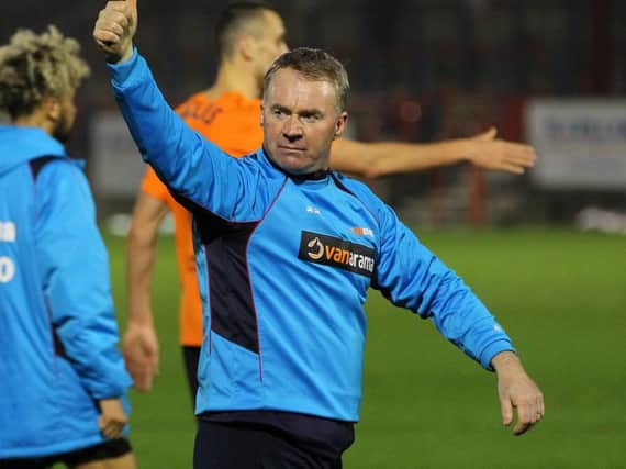 Chesterfield manager John Sheridan wants his team to believe in themselves more as they prepare to face Woking on Tuesday.