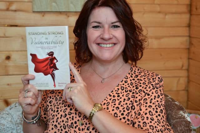 Madeleine Slack with her new book. Picture by Rachel Atkins.
