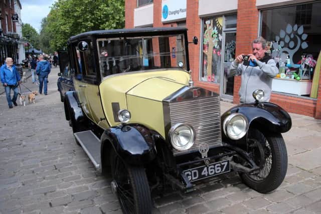 Mick Brennan takes a picture of a Rolls Royce at this year's Chesterfield Motor Fest.