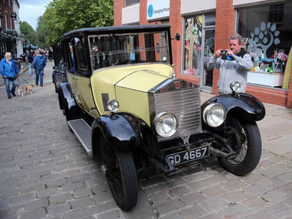 Mick Brennan takes a picture of a Rolls Royce at this year's Chesterfield Motor Fest.