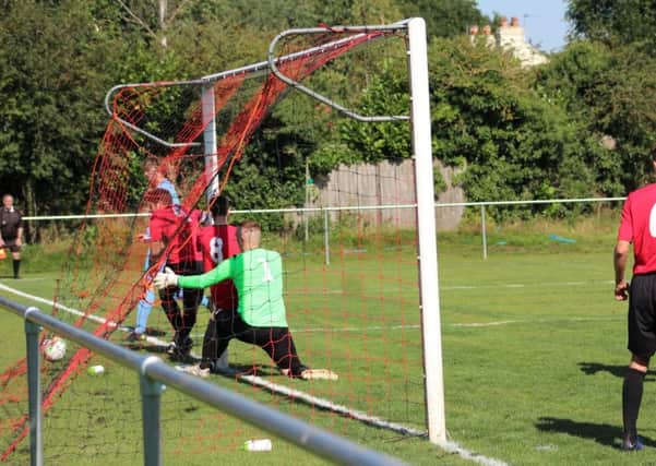 Josh Parfitt squeezes the ball home for Clay Cross Towns winner at Linby Colliery Welfare.