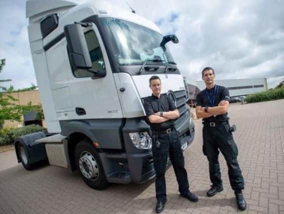 PC Dave Lee and PC Rob Monk from Northamptonshire Police's Safer Roads Team with one of the HGV supercabs. Picture courtesy of Northamptonshire Police.