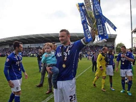 Ian Evatt pictured lifting the League Two trophy for Chesterfield.