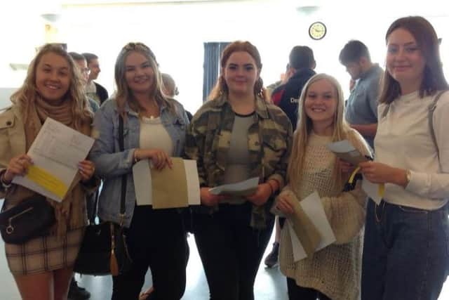 Students collect their GCSE results.