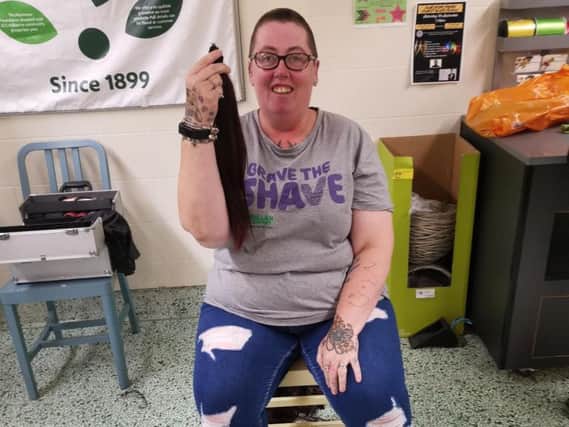 Lynser Orwin has had her hair shaved off for Macmillan.