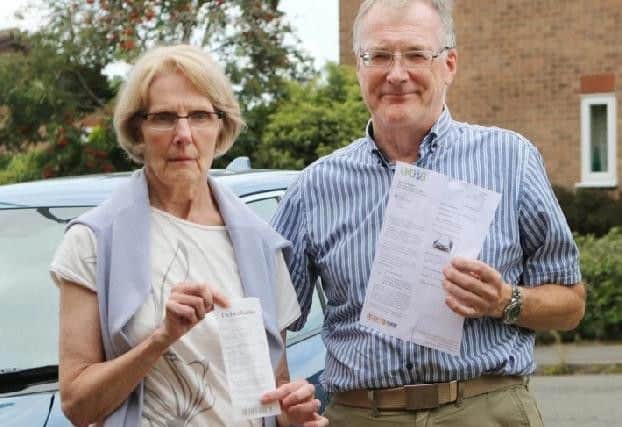 Philip and Janette Court with the parking fine they wrongly received.