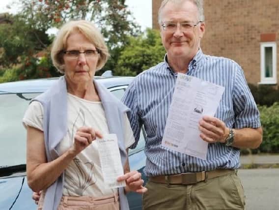 Philip and Janette Court with the parking fine they wrongly received.